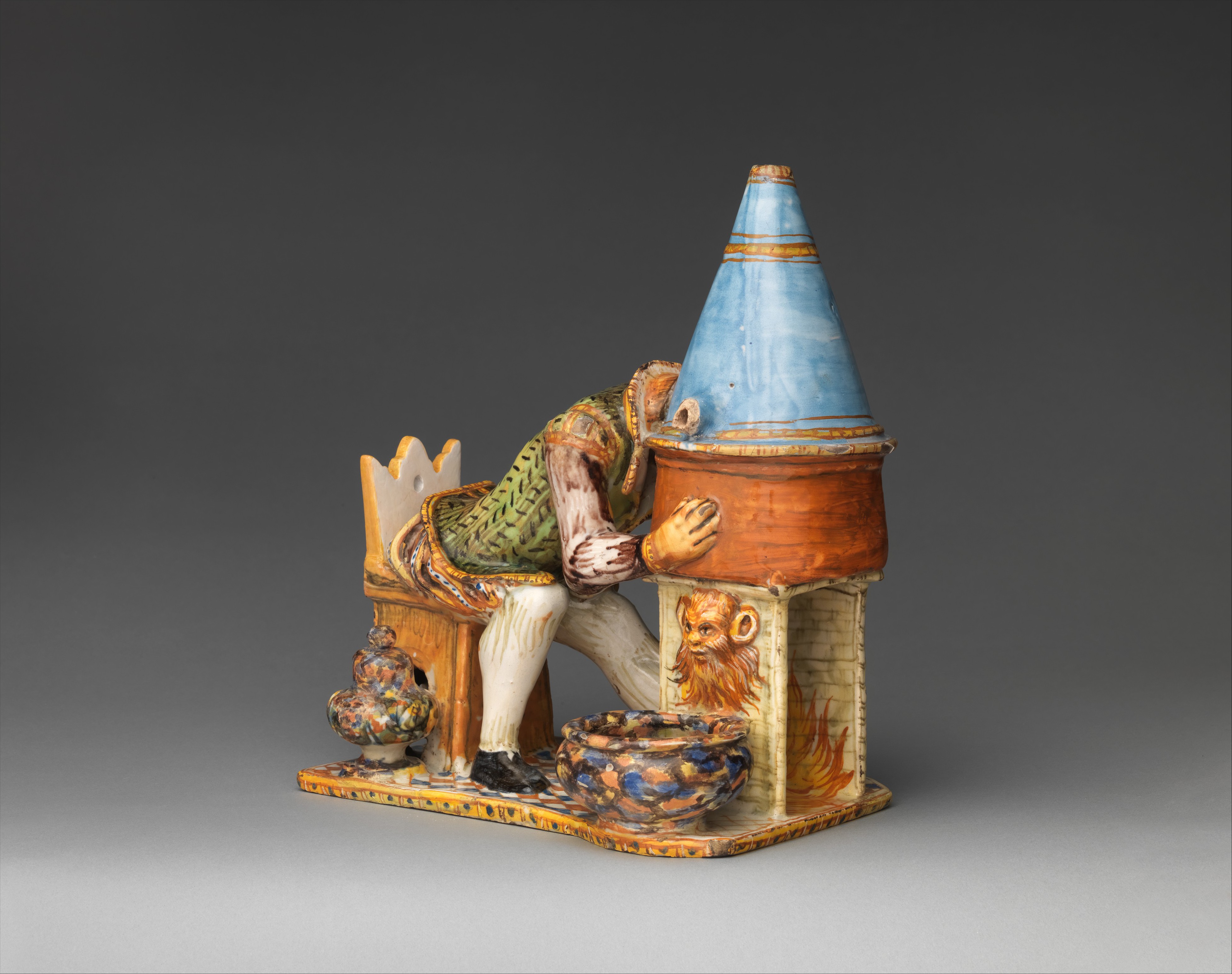 Inkstand with a madman distilling his brains